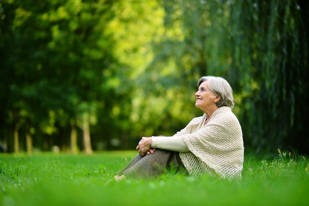 Senior Woman Sitting on Grass_Light Therapy for Dementia