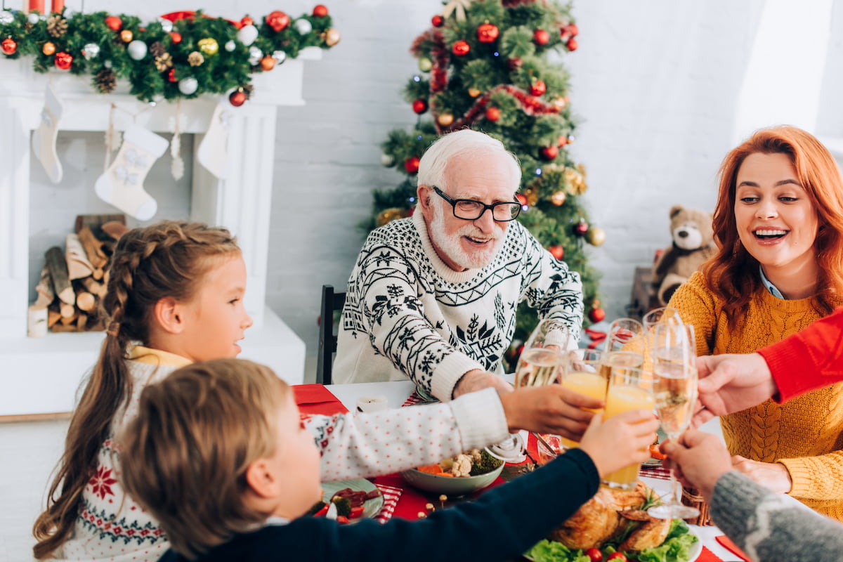 Signs It's Time for Boca Raton Senior Living This Holiday Senior Man with Family at Christmas Celebration_Sunscape Boca Raton