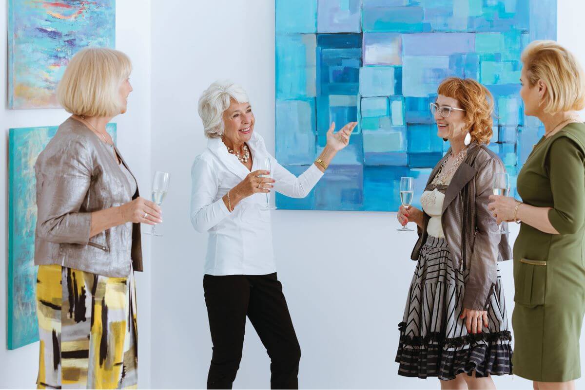 Expressions of Life Art Show | Sunscape Boca Raton seniors looking at art expression of art show walk to end alzheimers