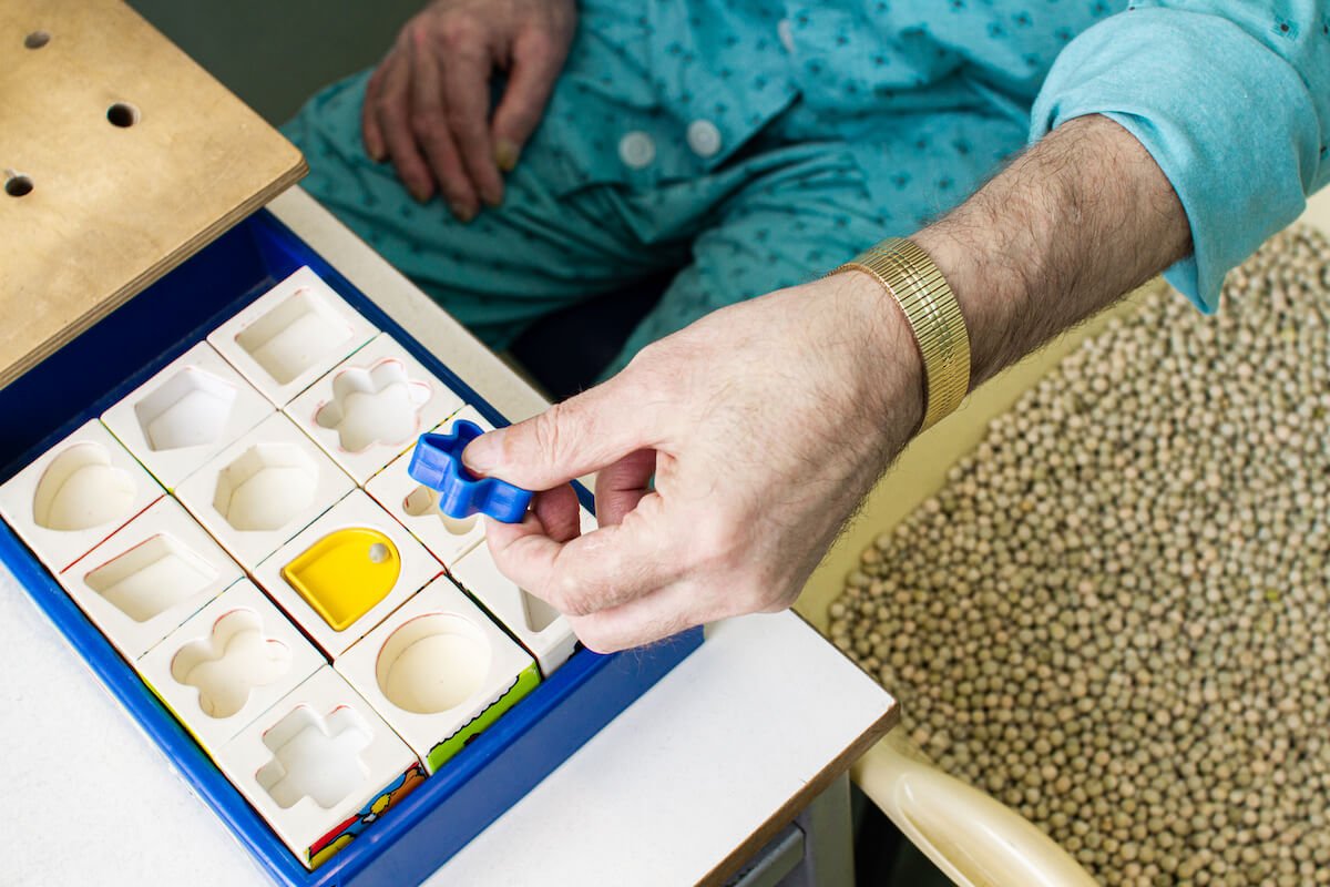 Woman putting puzzle together