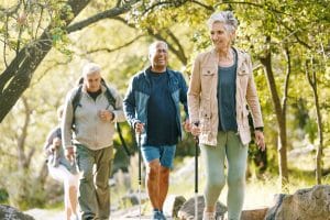 How Senior Living in Boca Raton Empowers Older Adults Seniors walking together.