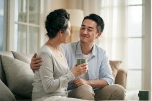 Why Do Seniors Resist Assisted Living? Adult son talking to his mother