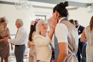 Celebrating Mother’s Day with Mom in Assisted Living Adult son dancing with his mom on Mothers Day