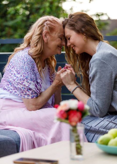 adult child with mother at memory care community boca raton florida