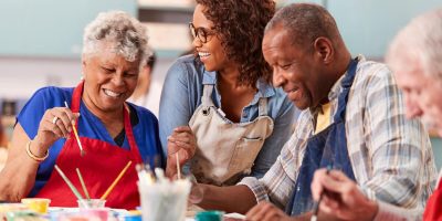 Group of seniors with dementia at an arts and crafts class
